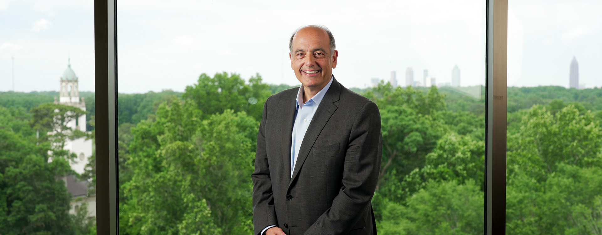 chris augostini posing in rose library with skyline behind